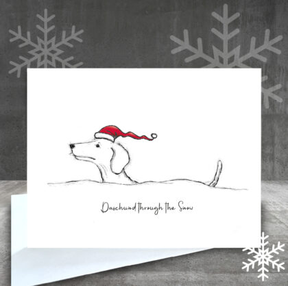 Dachshund running through the snow drawing on Christmas card